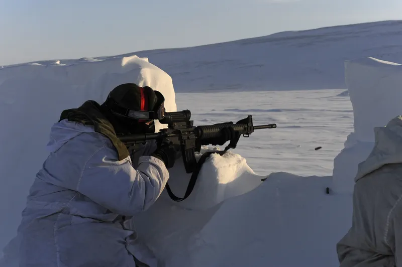 Soldier in snowy trench