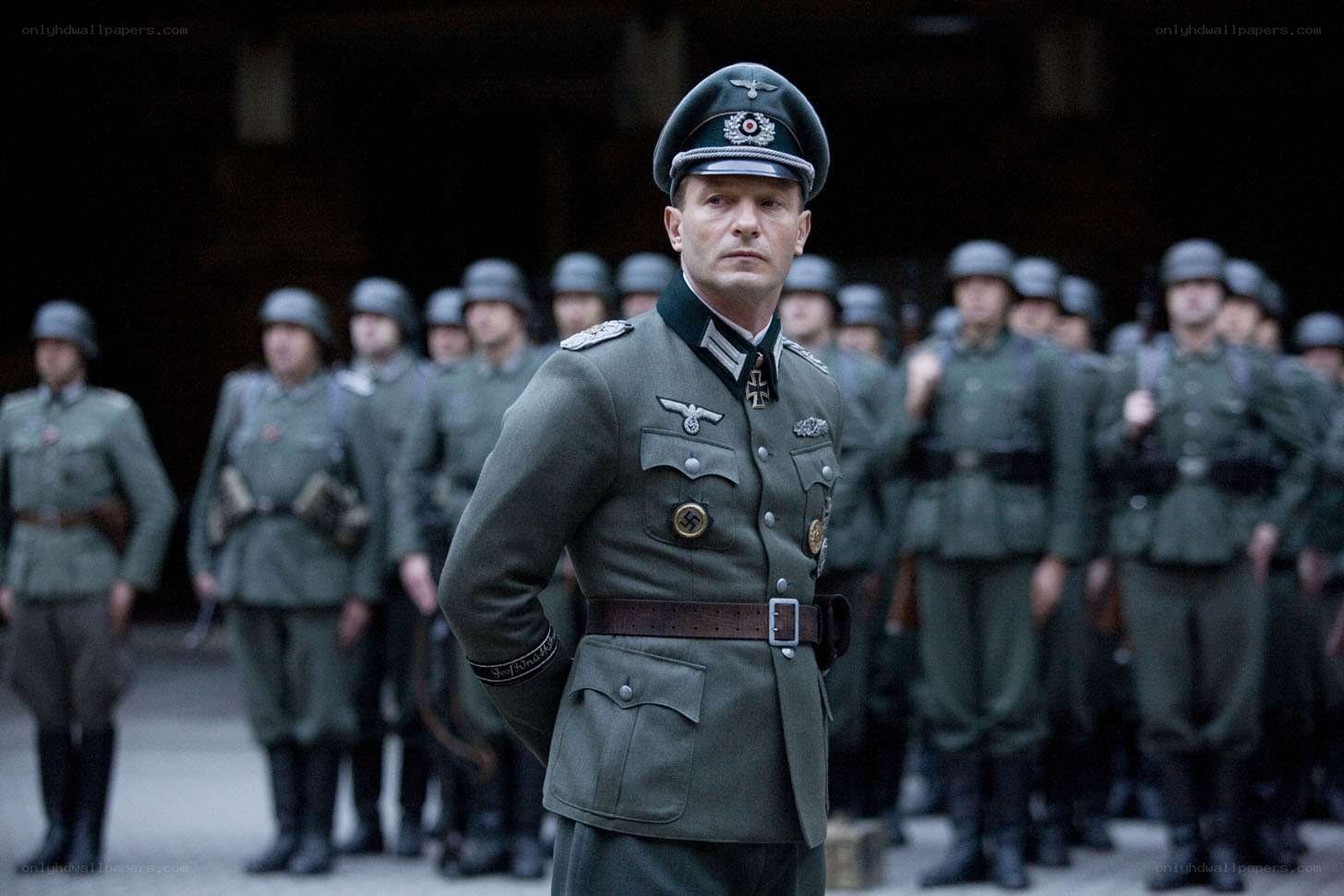 Soldier in uniform with troops