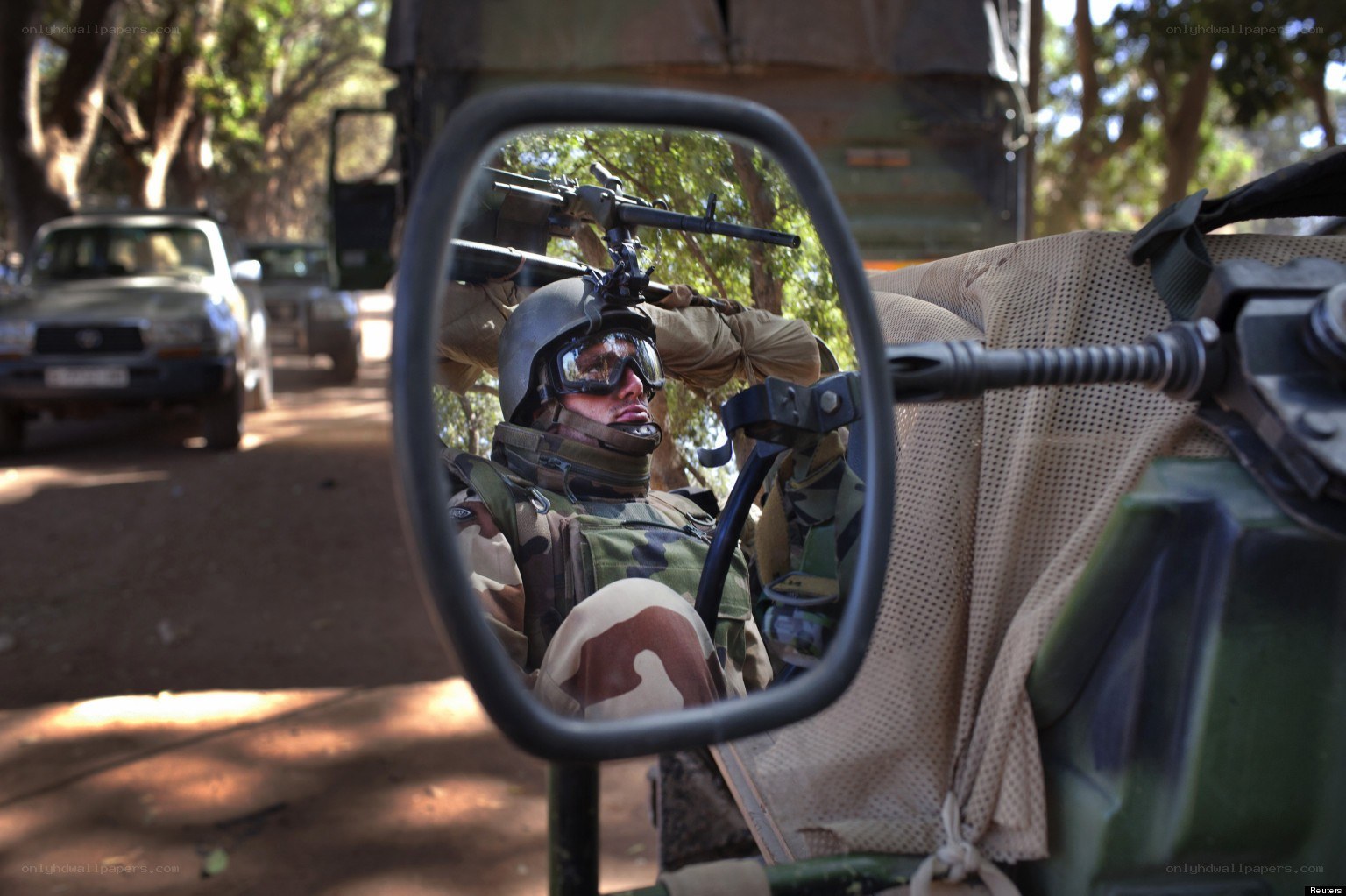 Soldier in vehicle mirror