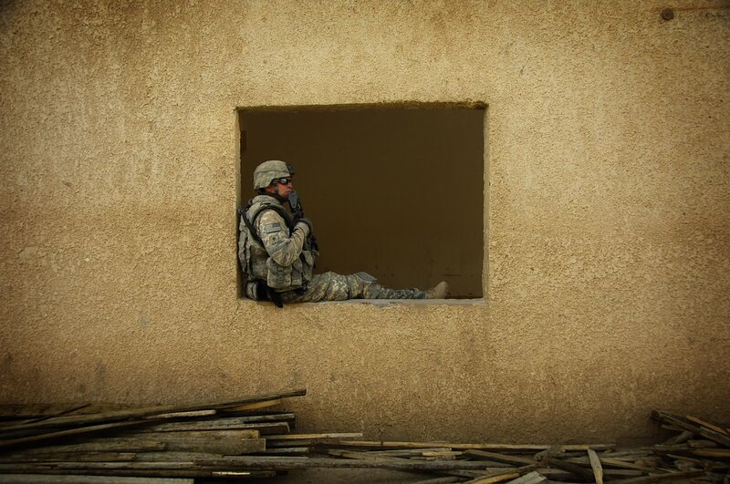 Soldier in window of building