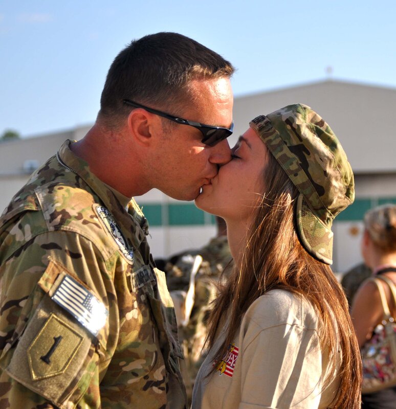 Soldier kissing his partner