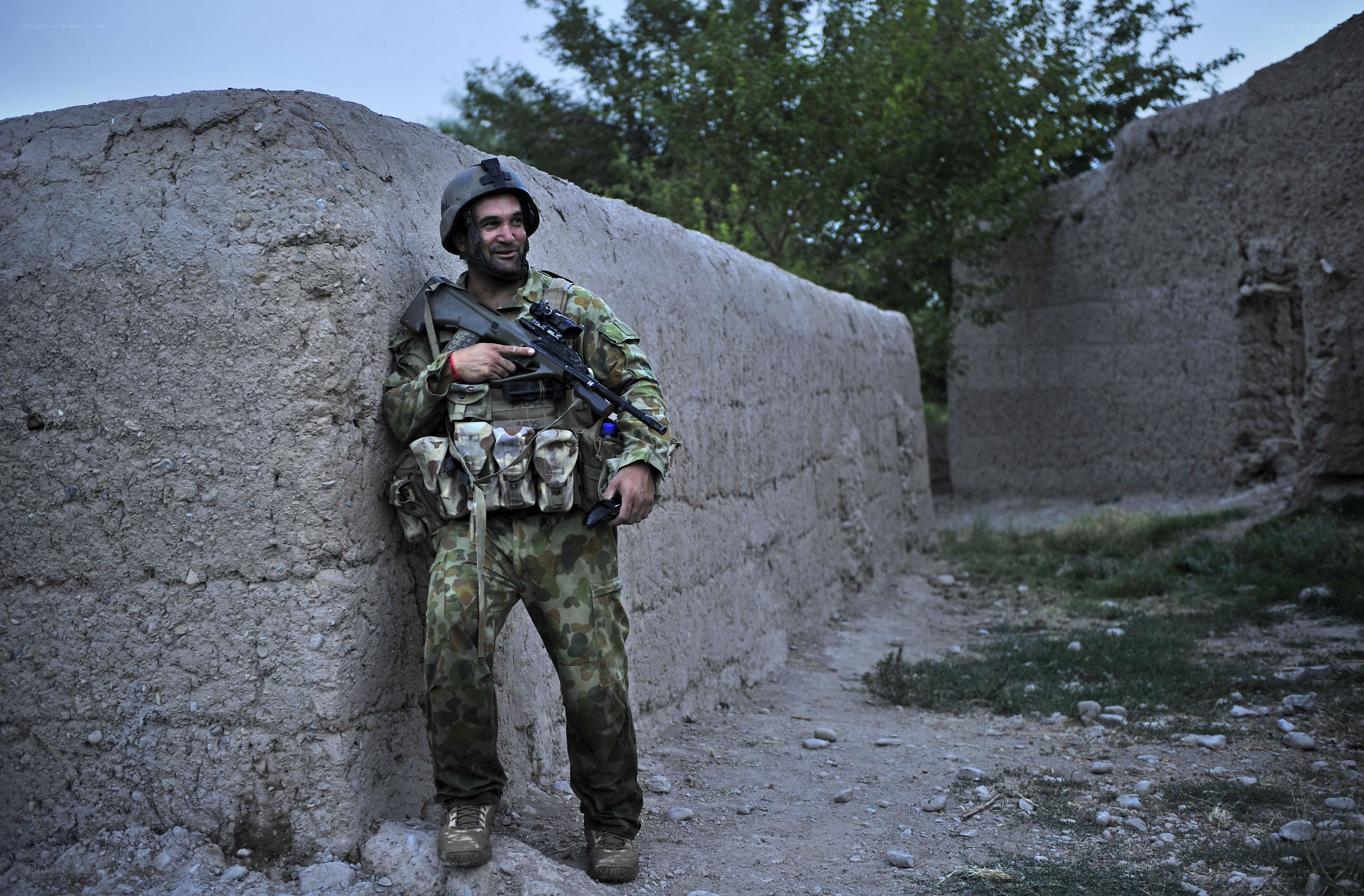 Soldier leaning against wall