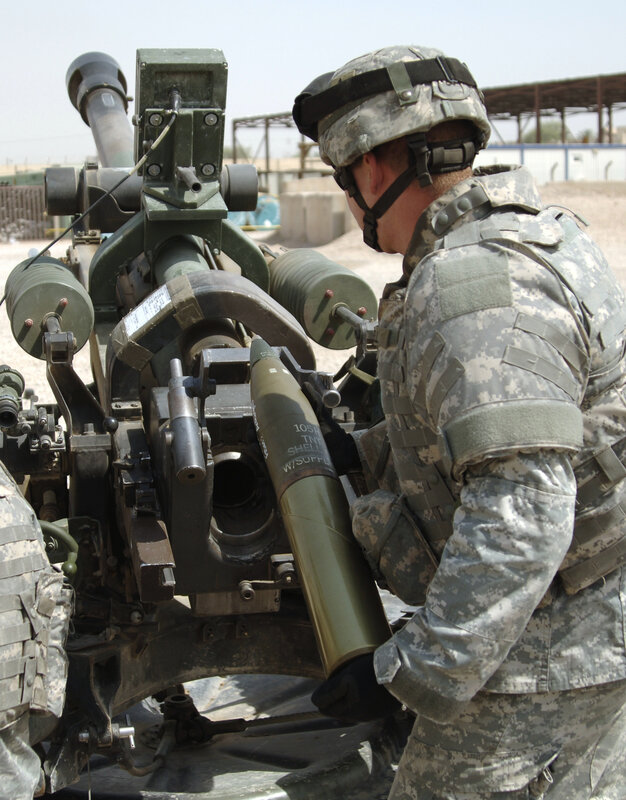 Soldier loading artillery shell