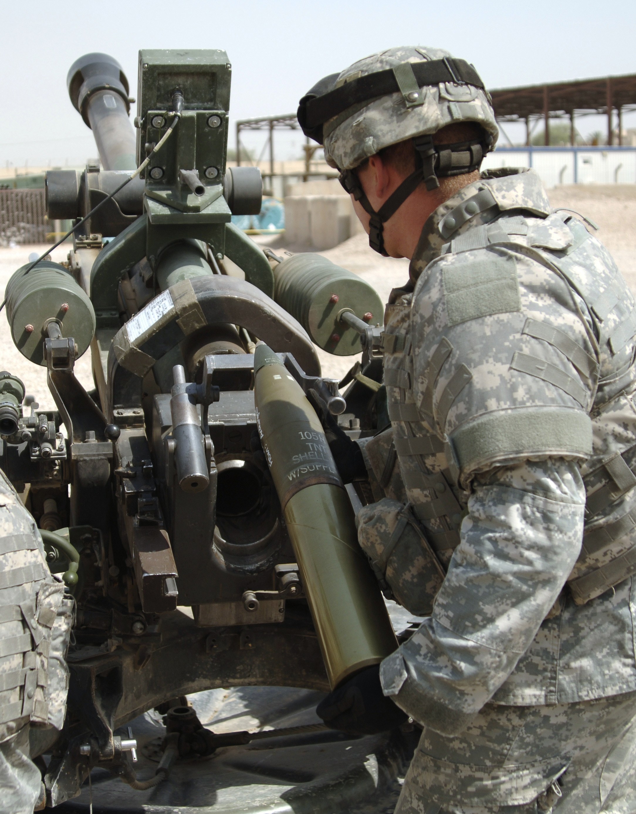 Soldier loading artillery shell