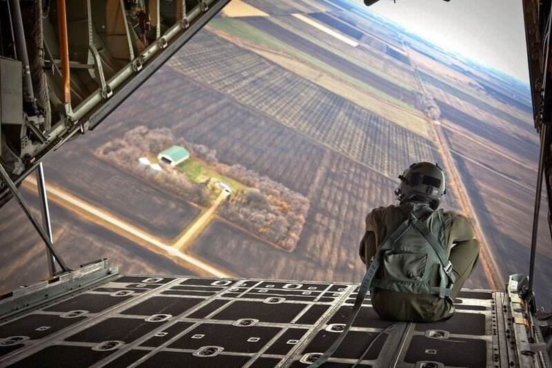 Soldier looking out of aircraft