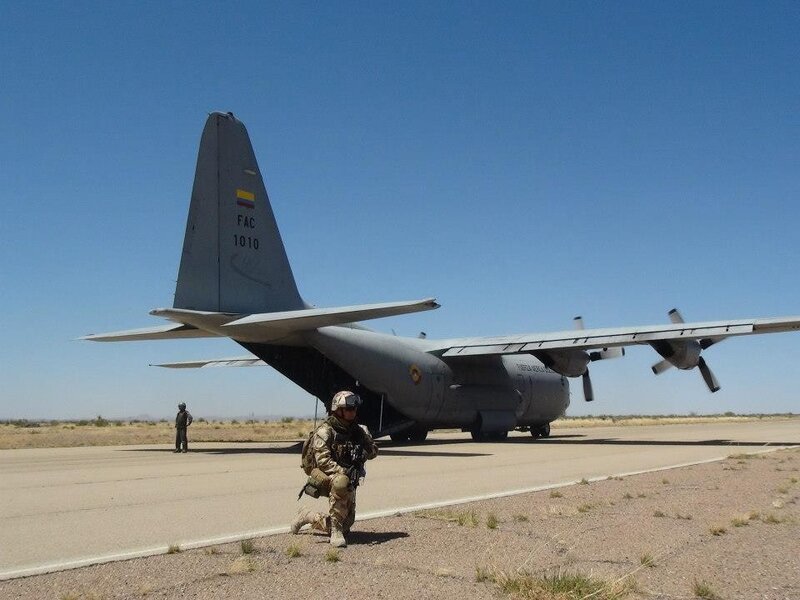 Soldier near military transport plane