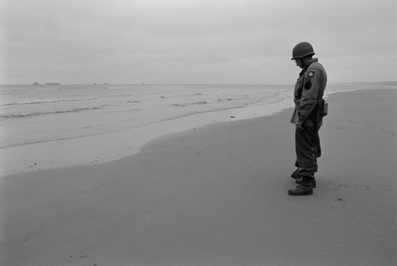 Soldier on a beach at dawn