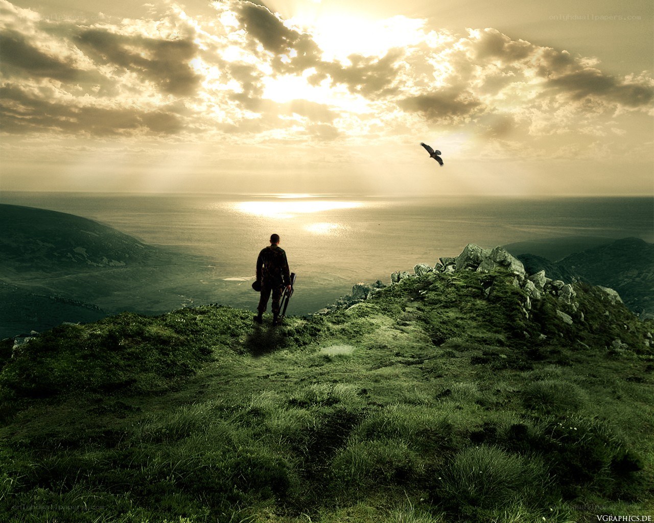 Soldier on a cliff at sunset