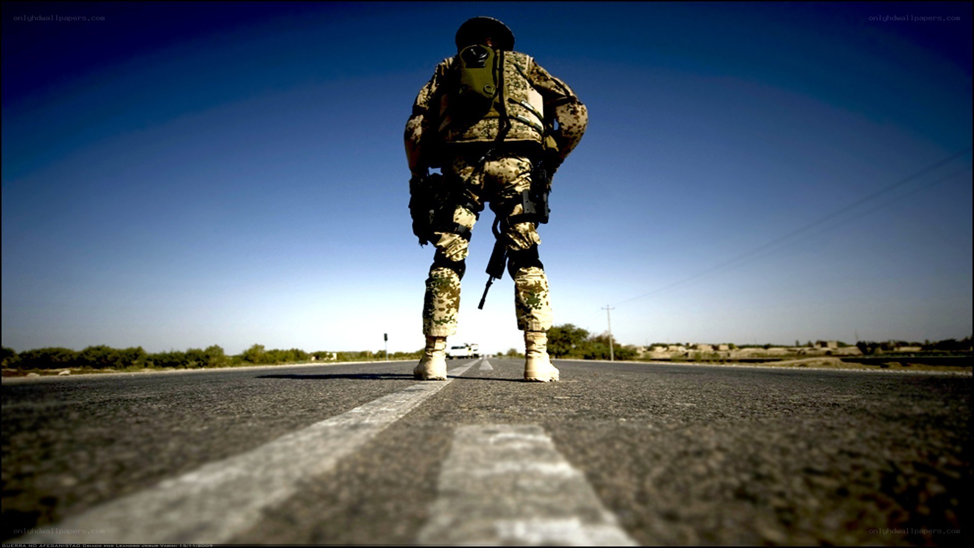 Soldier on a desert road