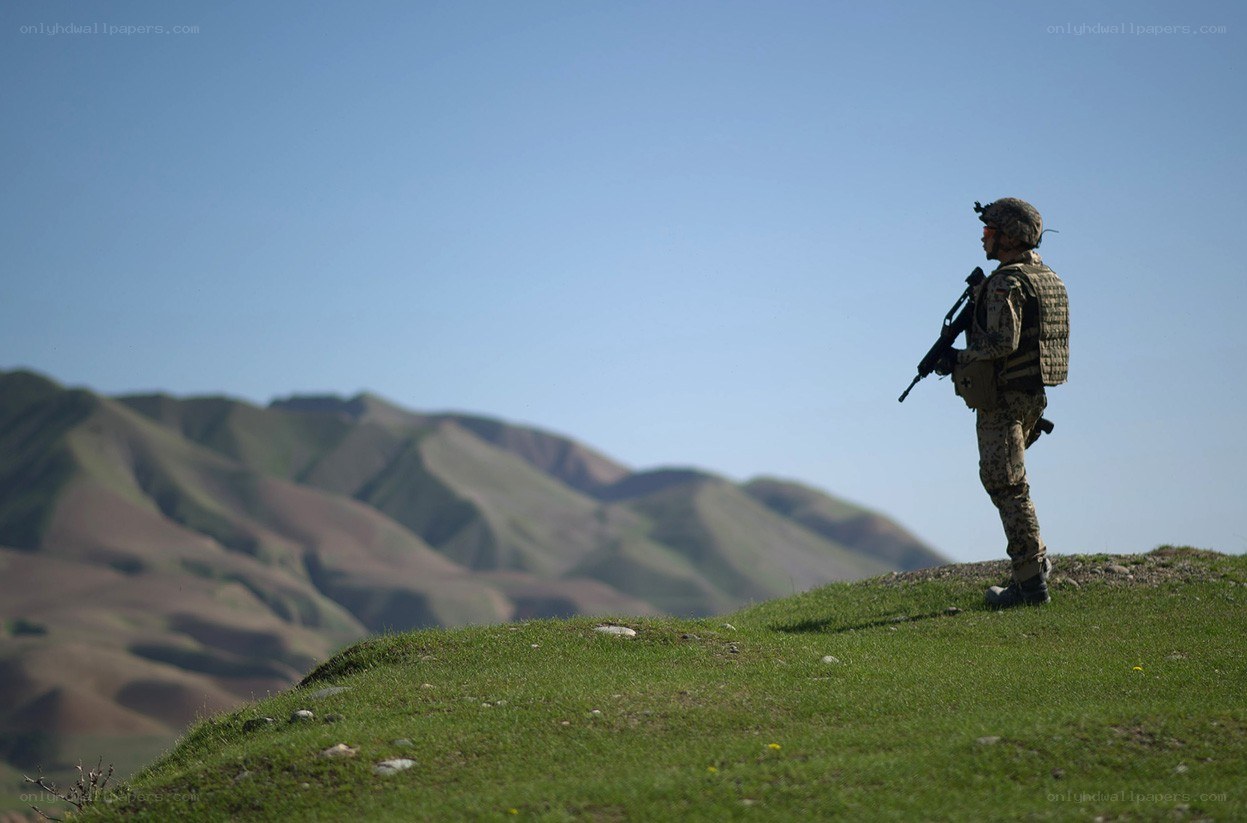 Soldier on a hilltop