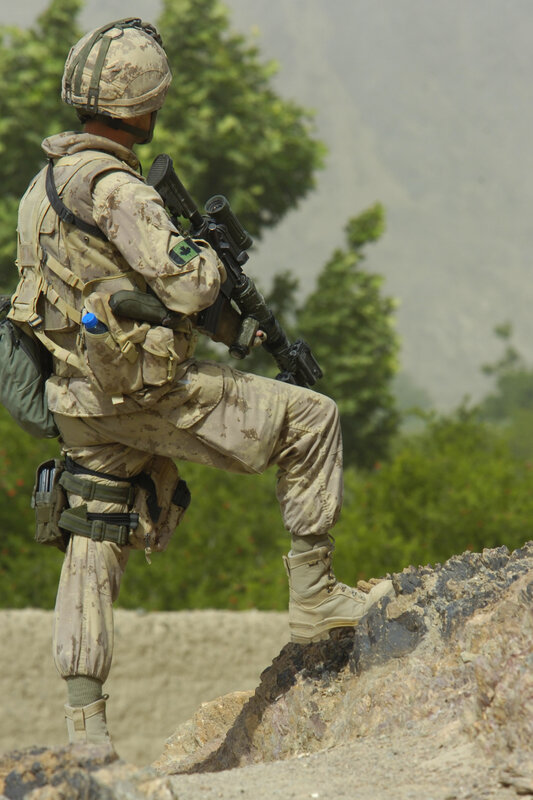 Soldier on a rocky outcrop