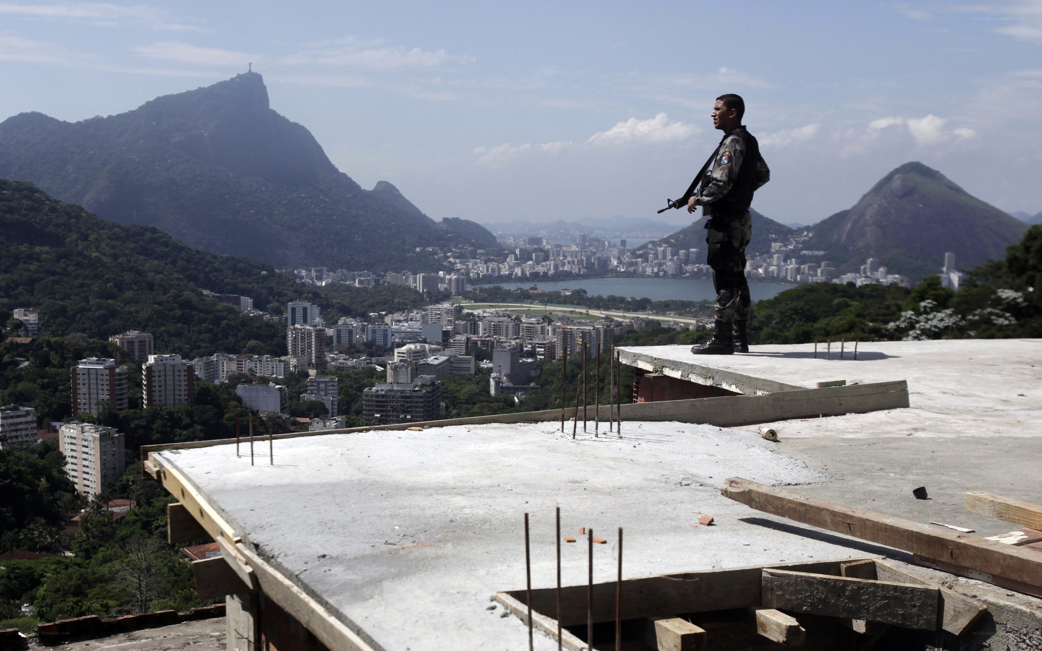 Soldier on a rooftop overlooking Rio