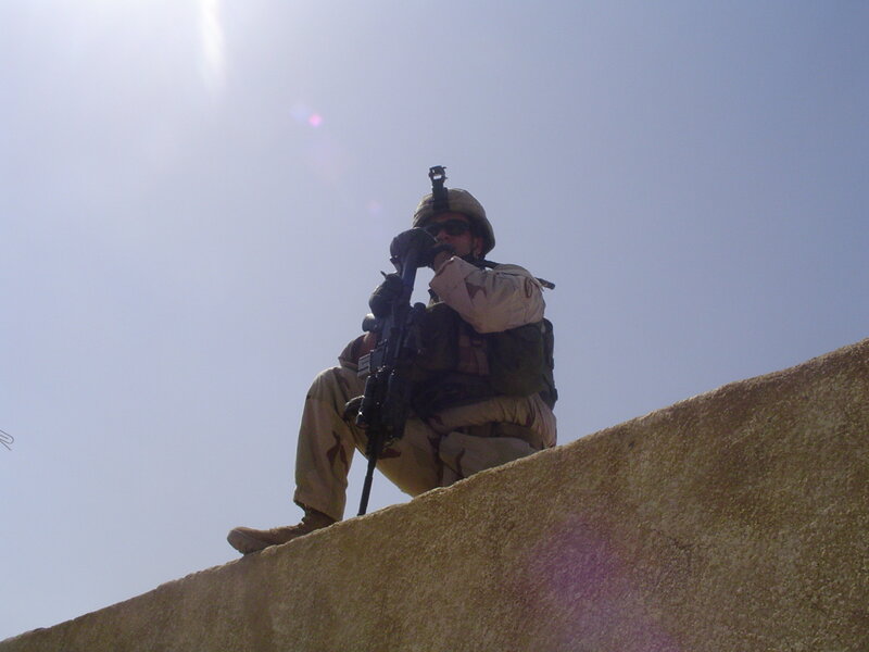 Soldier on a wall with rifle