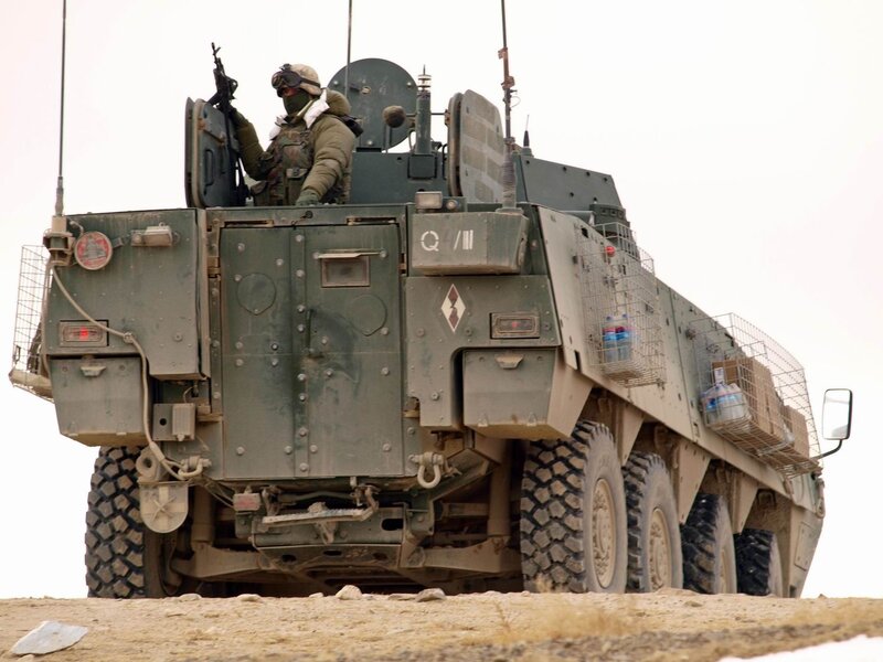 Soldier on armored vehicle