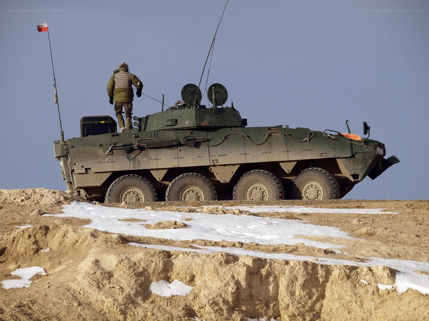 Soldier on armored vehicle