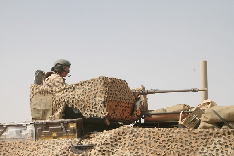 Soldier on armored vehicle