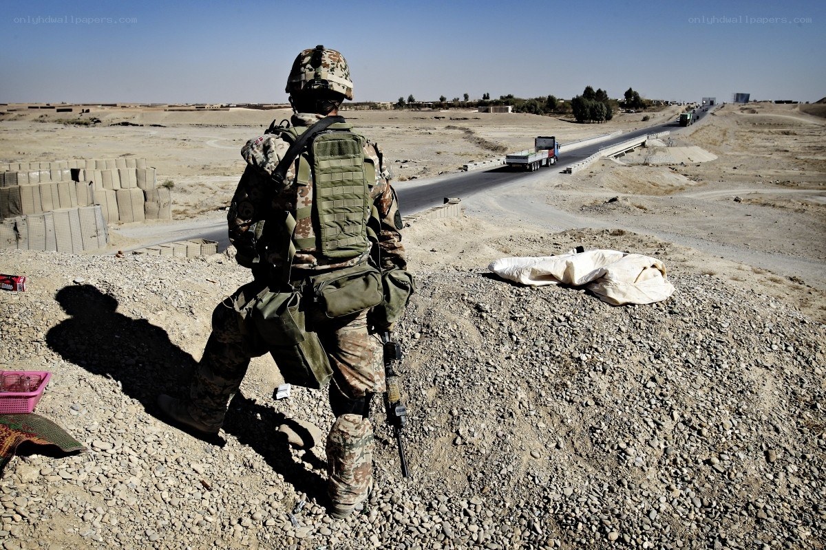 Soldier on guard in desert