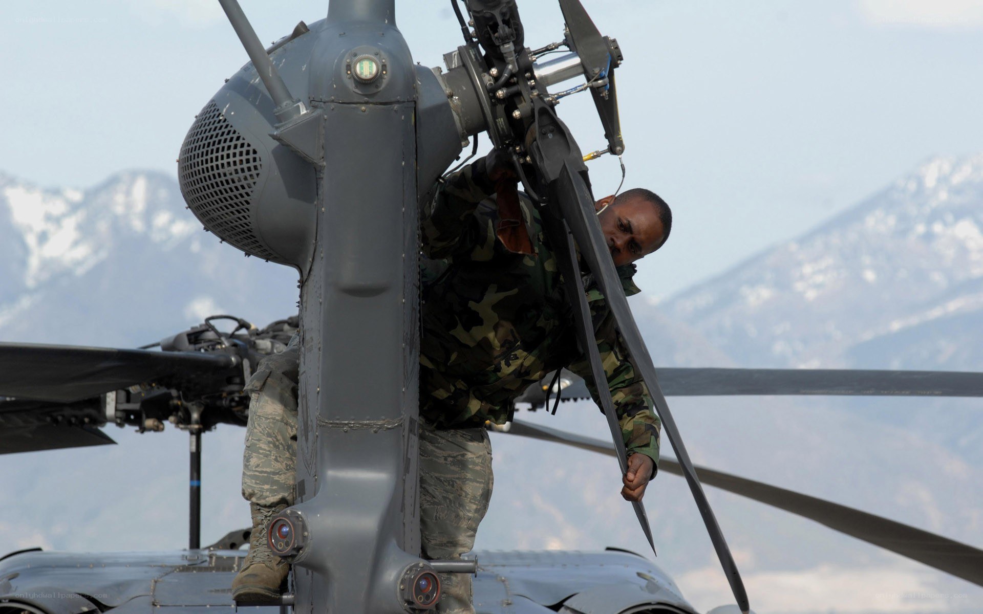 Soldier on helicopter rotor