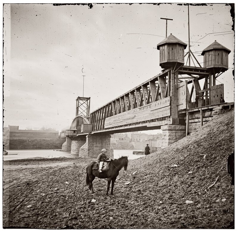 Soldier on horse near bridge