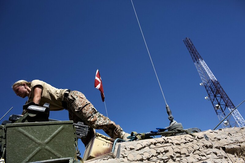 Soldier on military vehicle