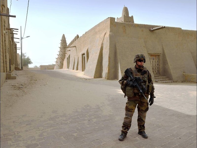 Soldier on patrol in a desert town