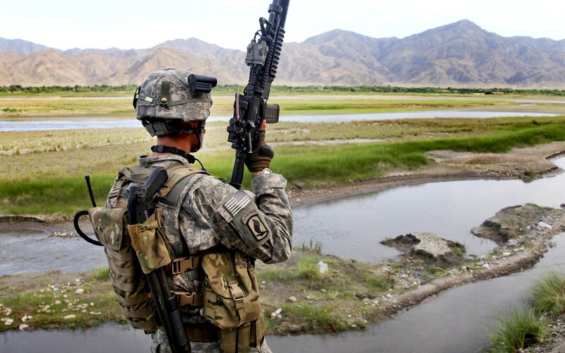 Soldier on patrol in mountainous terrain