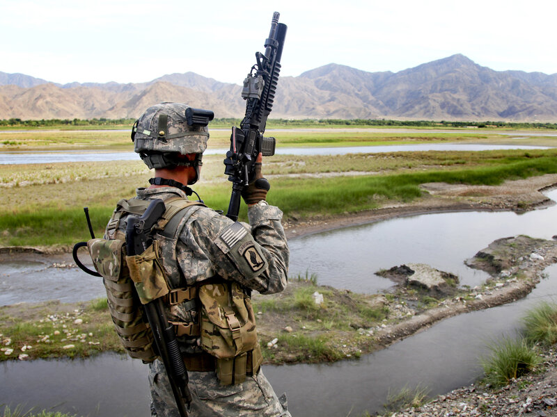 Soldier on patrol in mountainous terrain