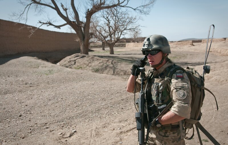 Soldier on radio in desert