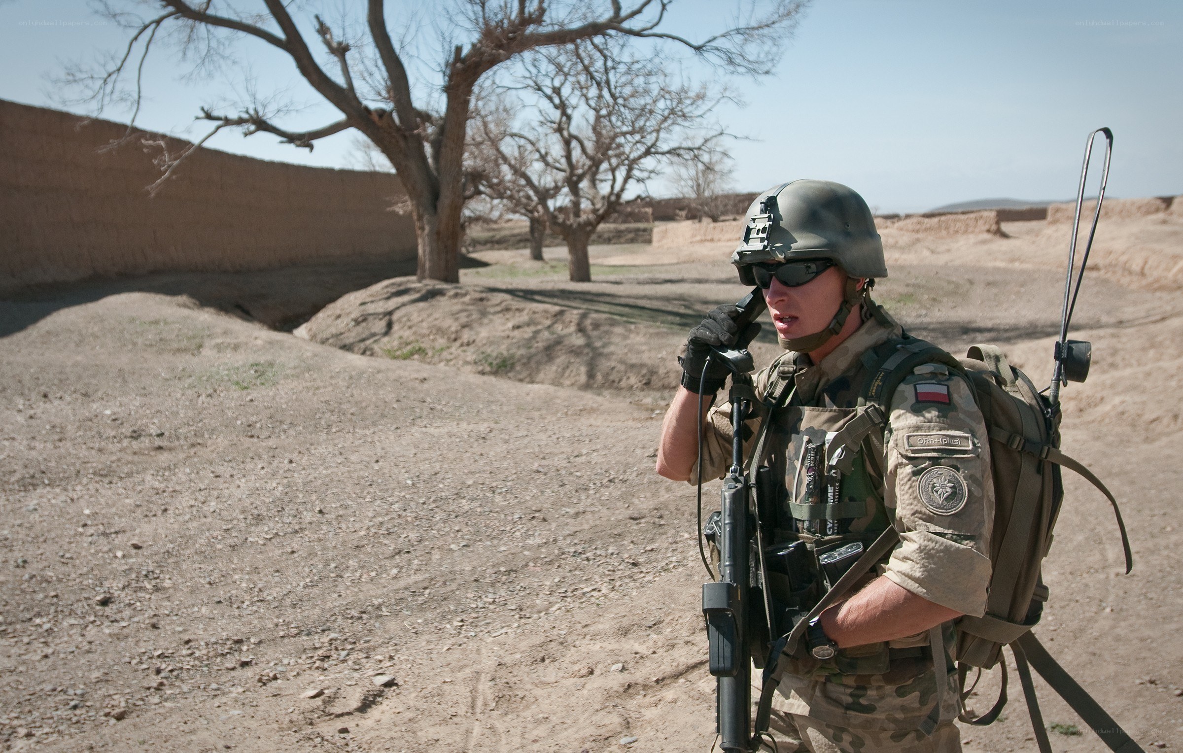 Soldier on radio in desert