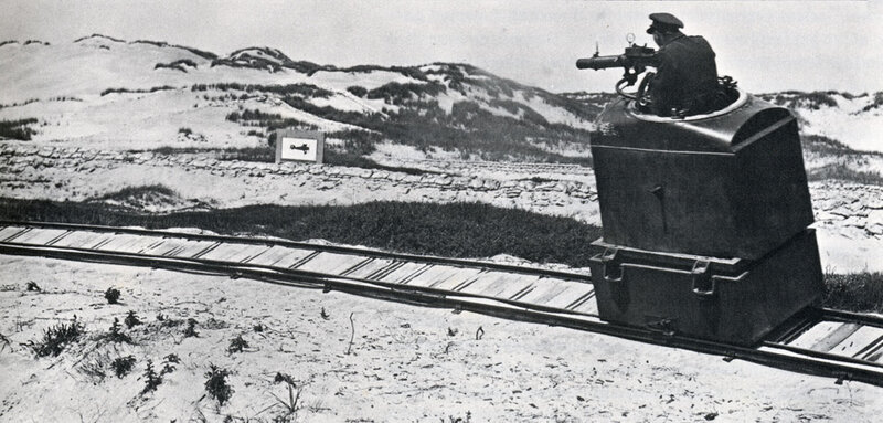 Soldier on rail-mounted gun