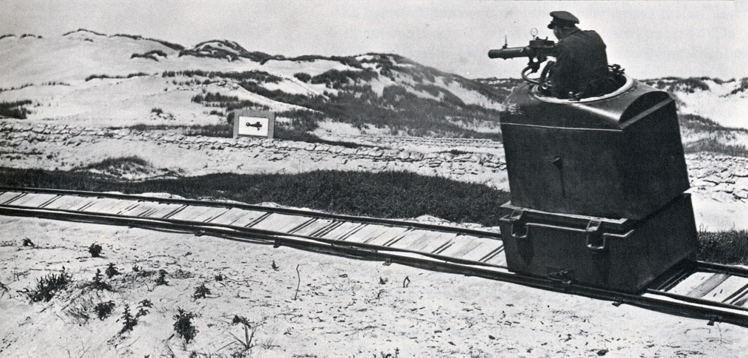 Soldier on rail-mounted gun