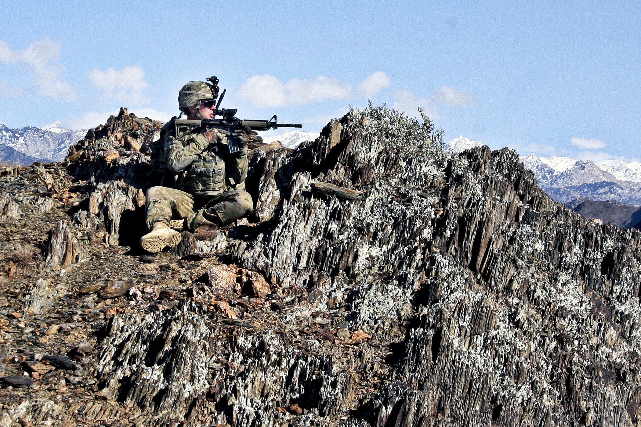 Soldier on rocky outcrop