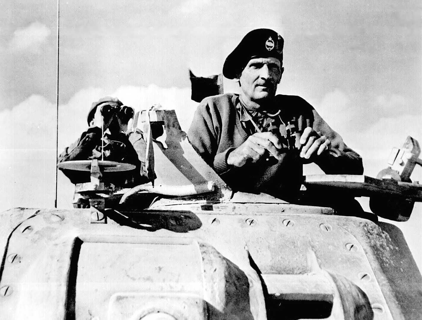 Soldier on tank in desert