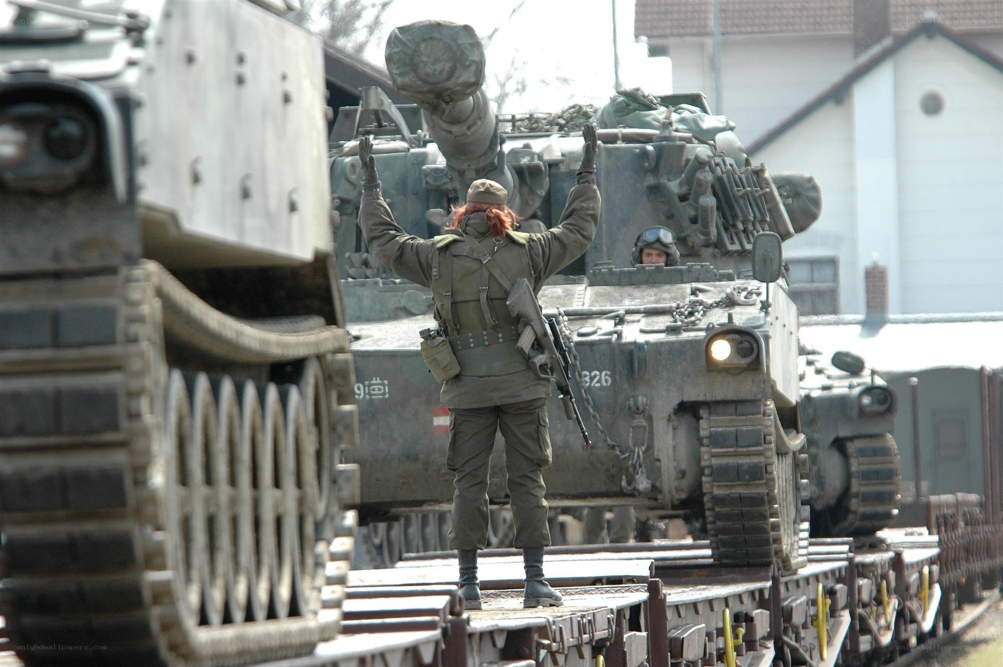 Soldier on tank train