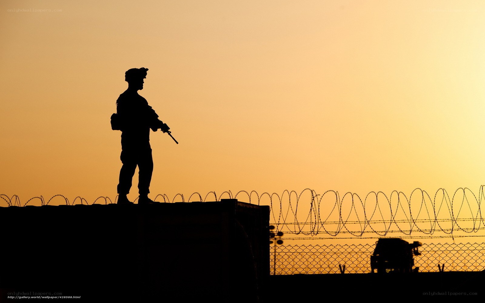 Soldier on watch at sunset