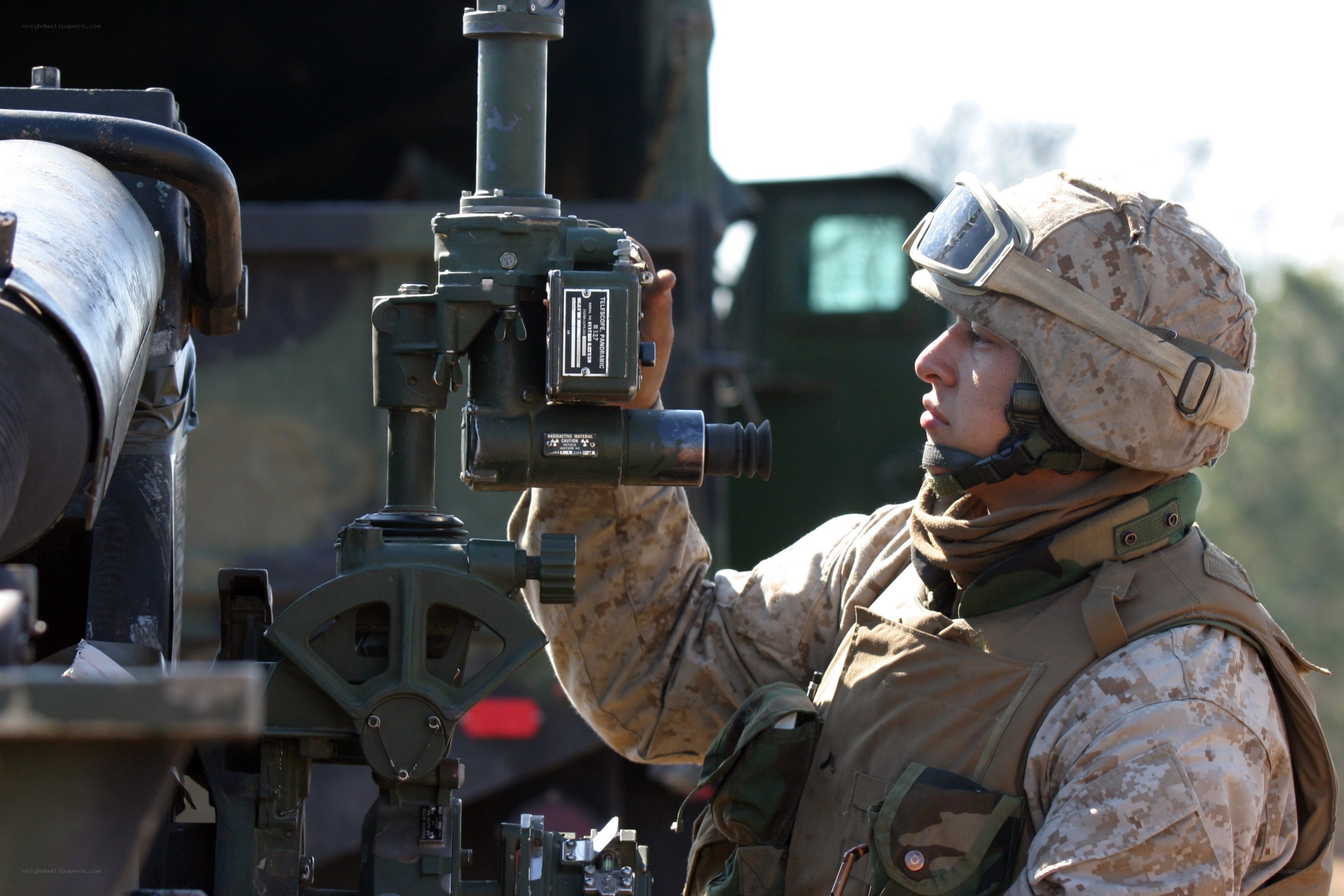 soldier operating artillery equipment