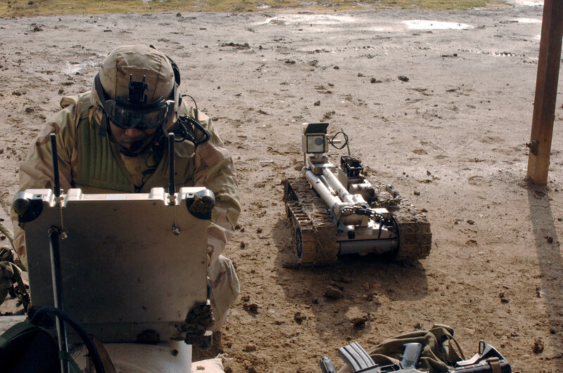 Soldier operating remote robot
