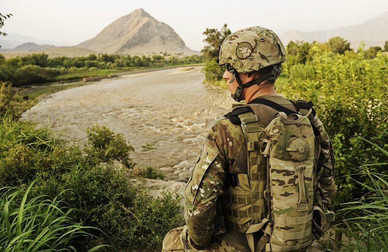 Soldier overlooking a river
