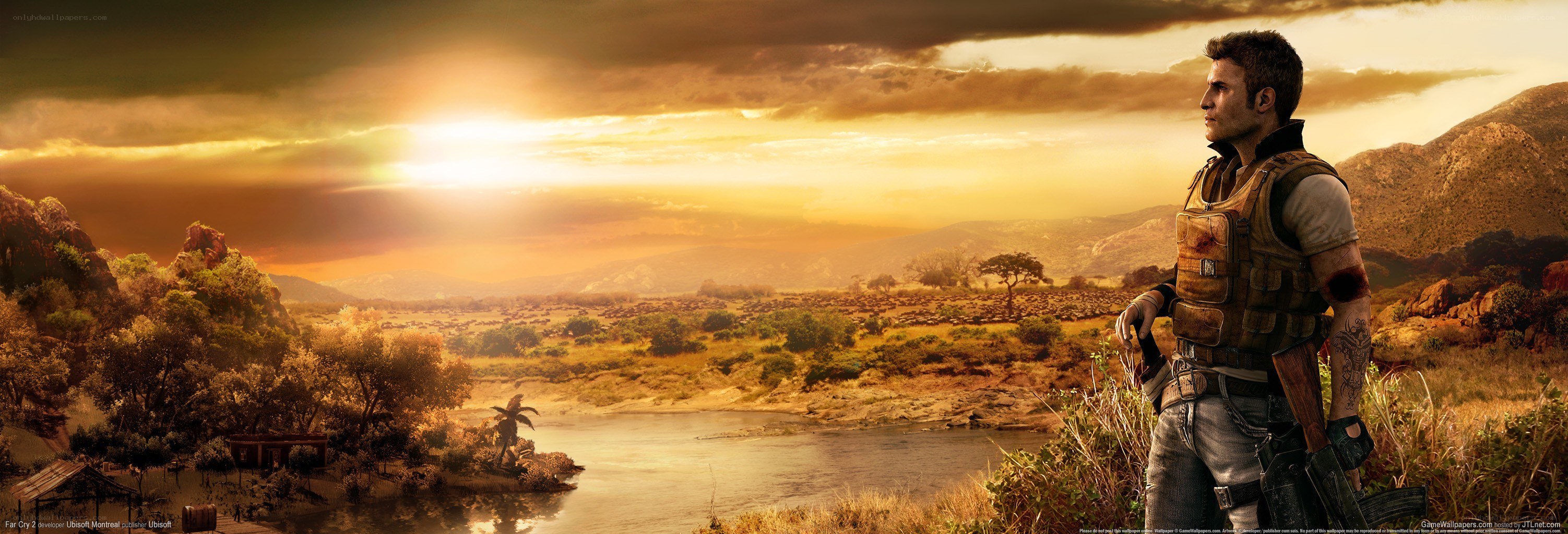Soldier overlooking a river at sunset