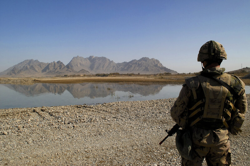 Soldier overlooking a river