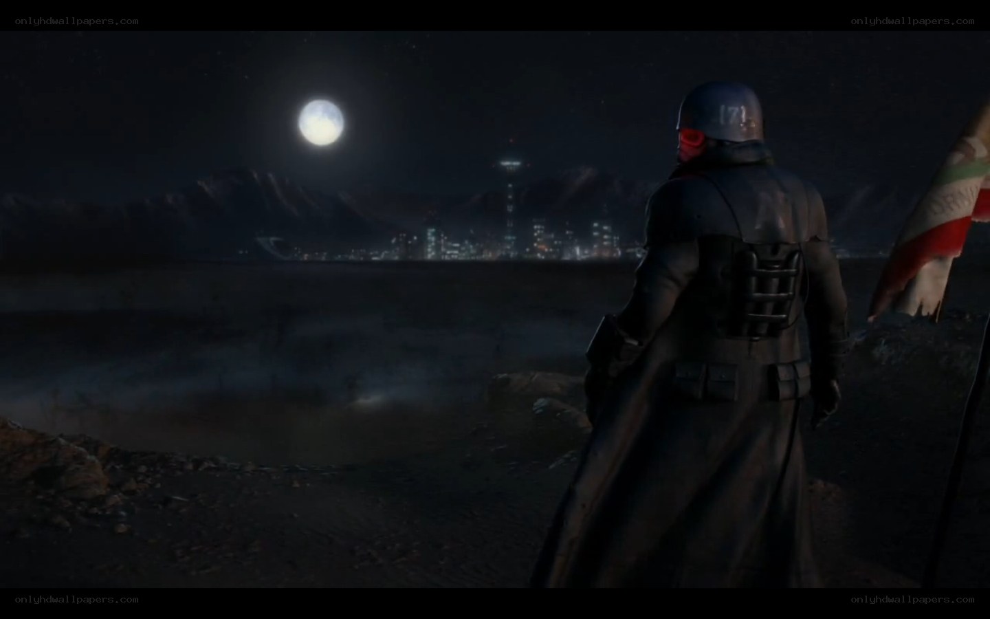 soldier overlooking city at night