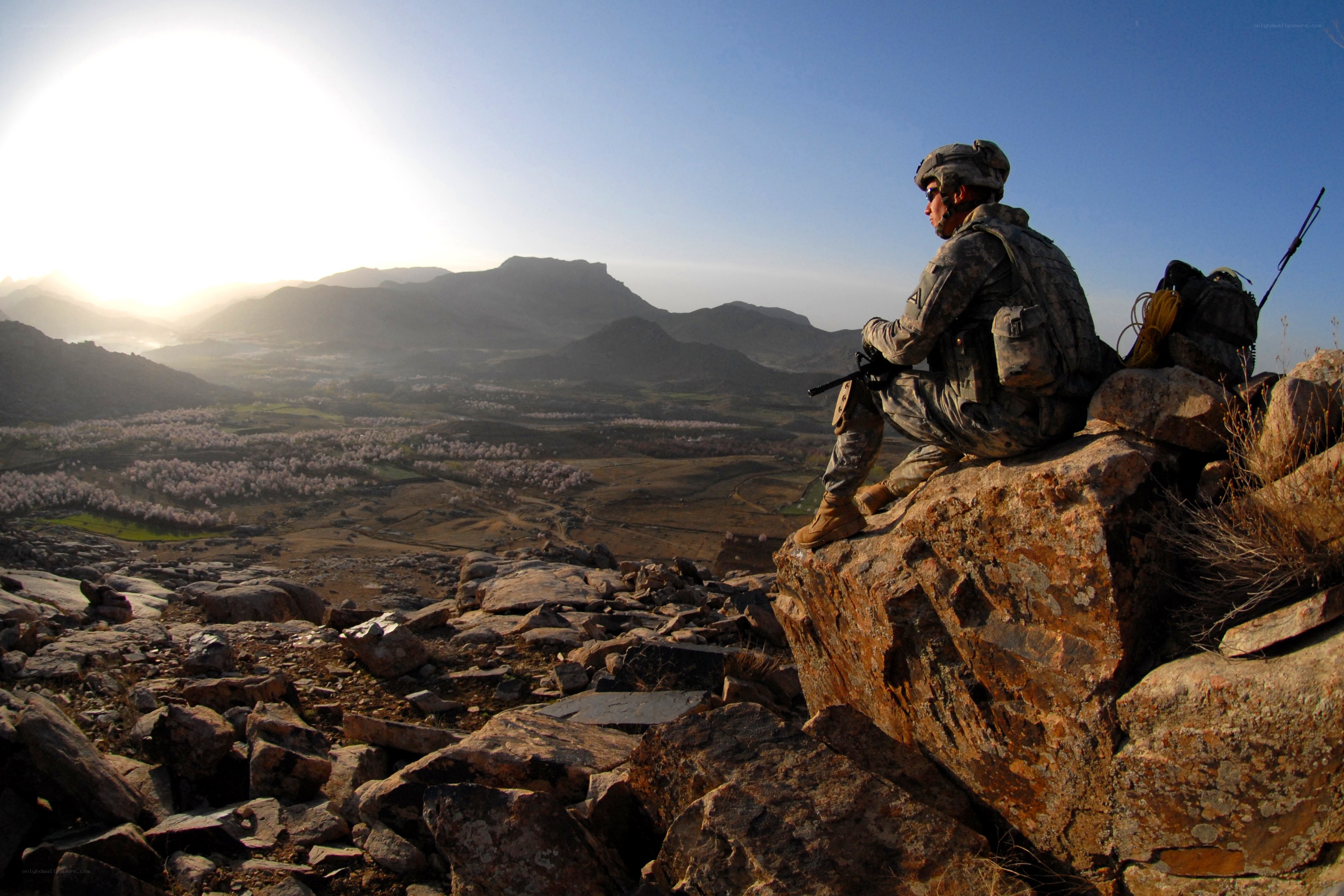 Soldier overlooking mountain valley