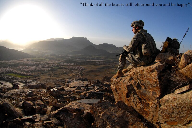 Soldier overlooking mountain valley