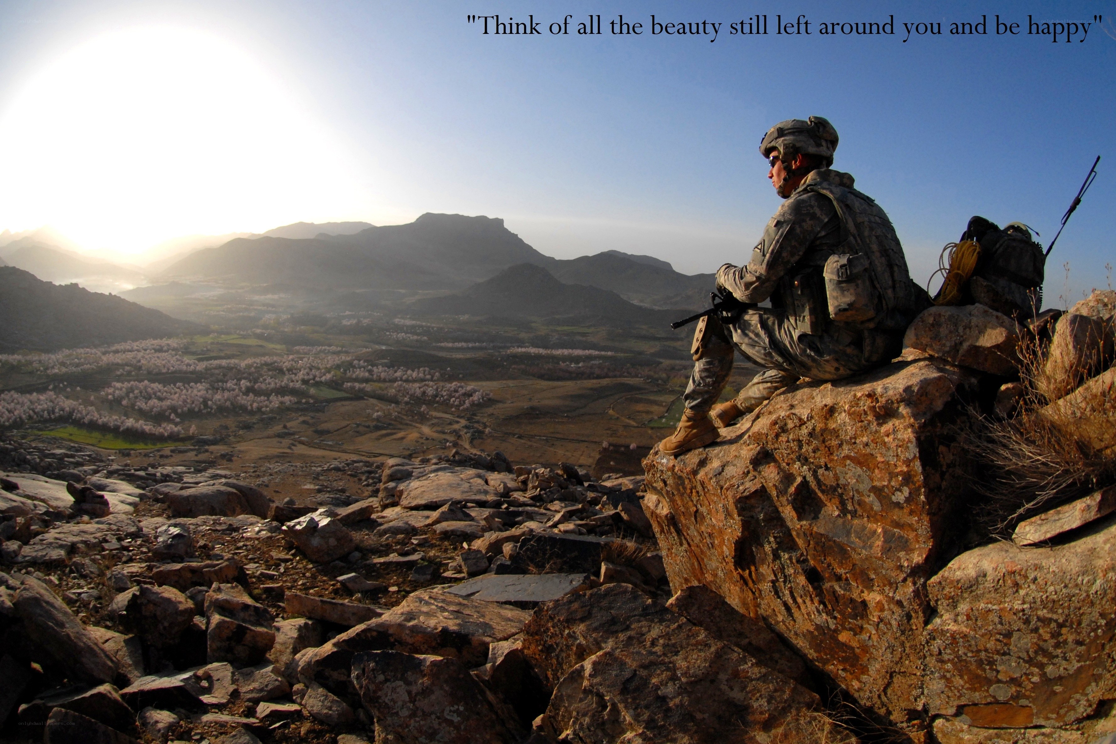 Soldier overlooking mountain valley
