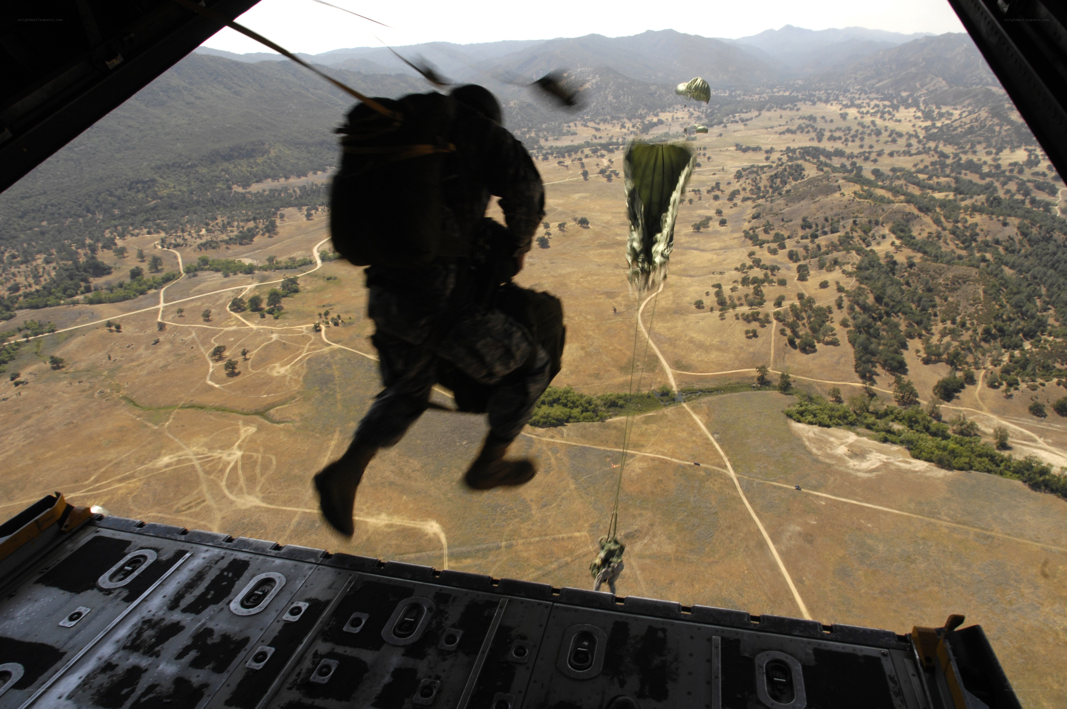 Soldier parachuting from aircraft