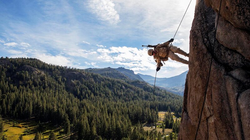 Soldier Rappelling Down Cliff