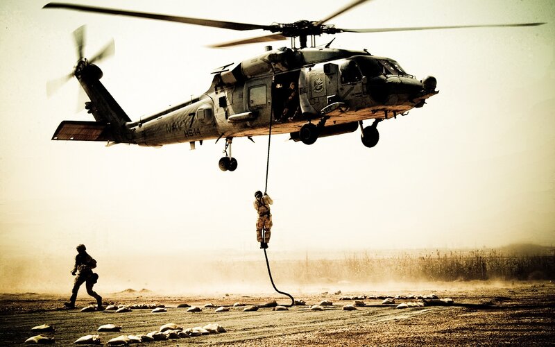 Soldier Rappelling from Helicopter — Brown, Dramatic, Photograph