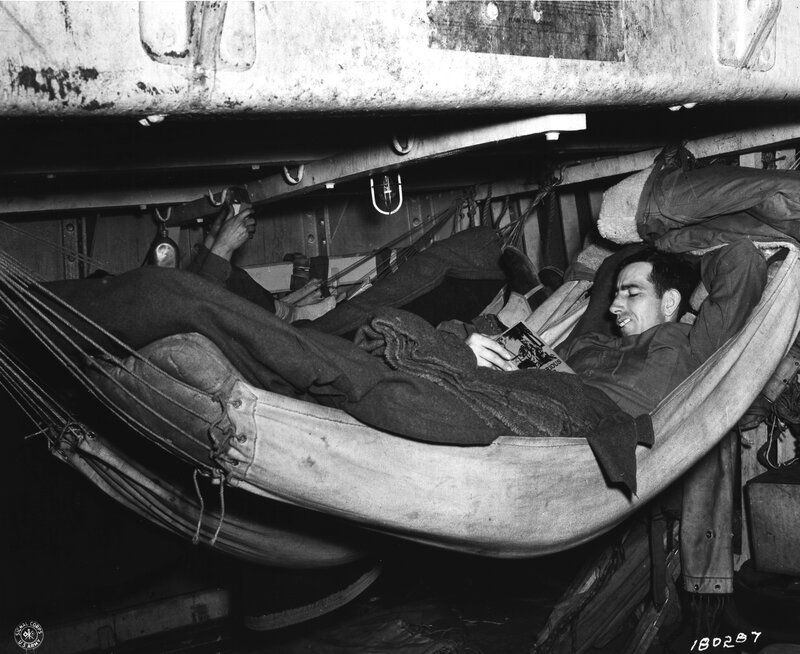 Soldier reading in a hammock