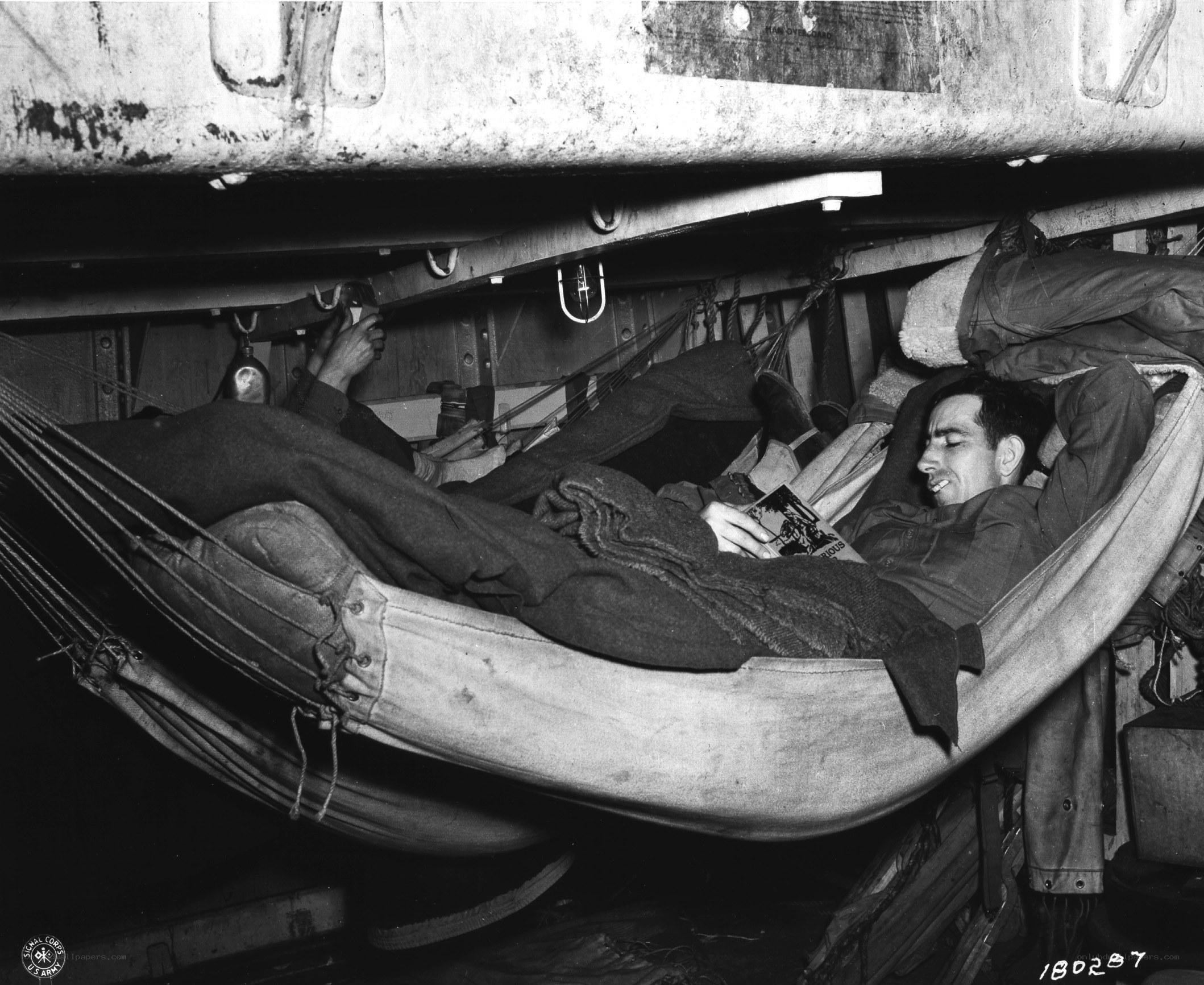 Soldier reading in a hammock