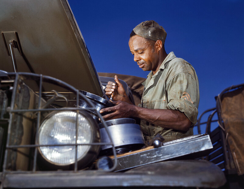 soldier repairing vehicle